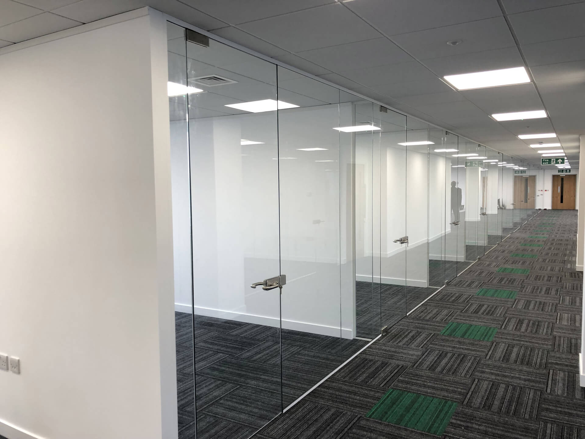 Frameless glass doors partitions in office Frameless glass doors partitions in office