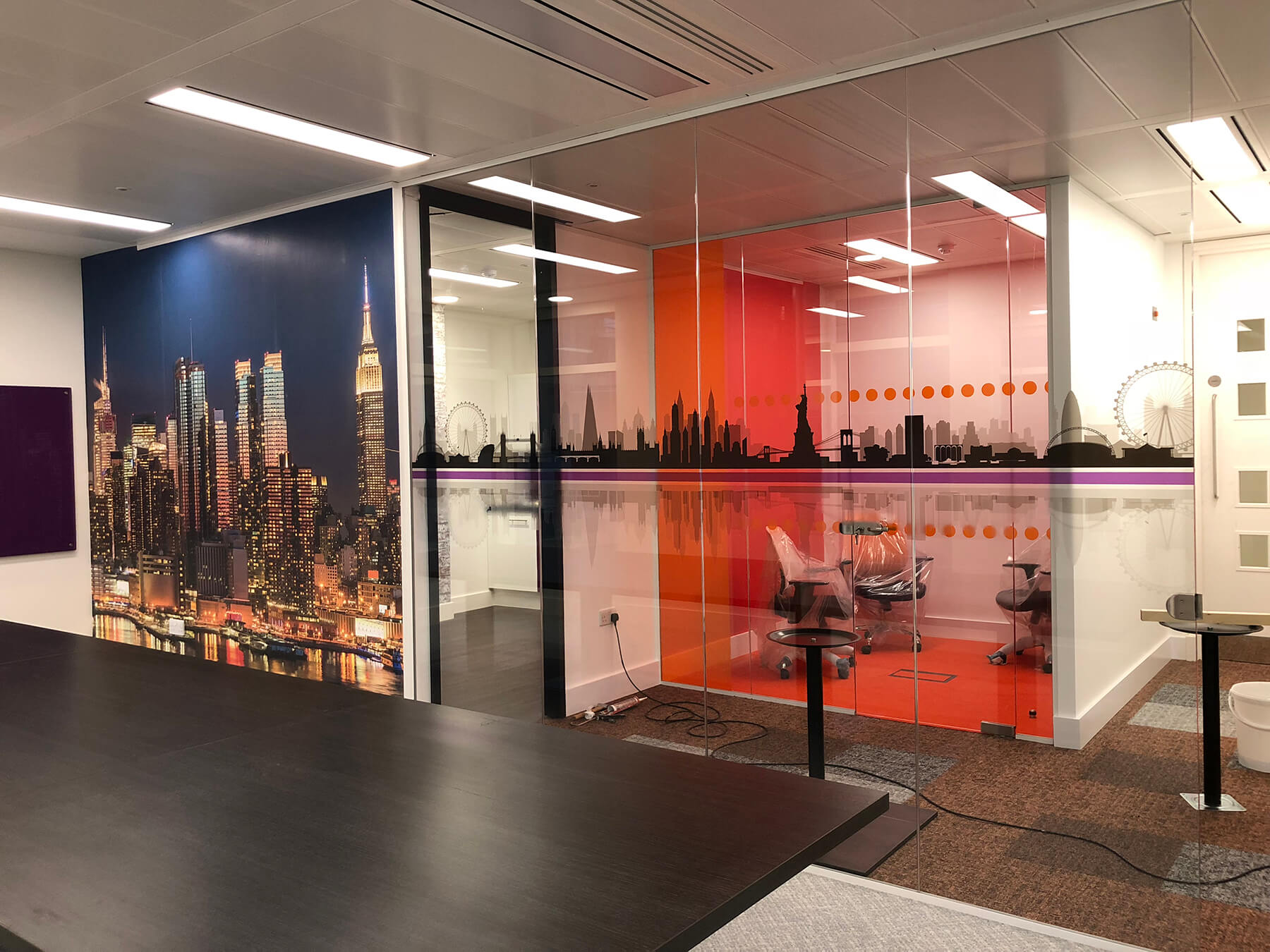 Glass partitions with designer walls Glass partitions with designer walls