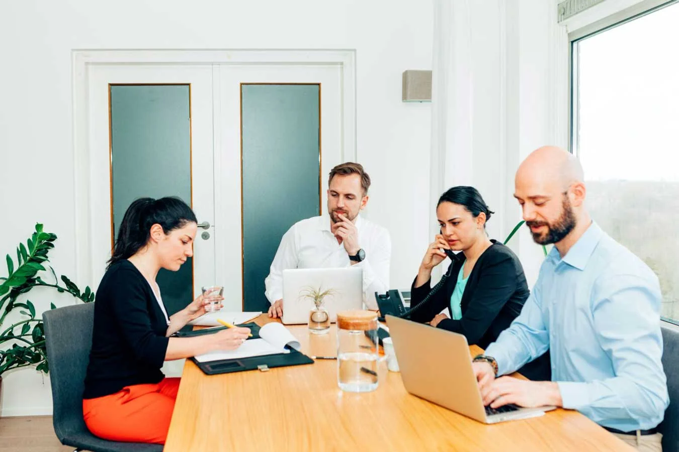 Group of female and male colleagues working together Group of female and male colleagues working together