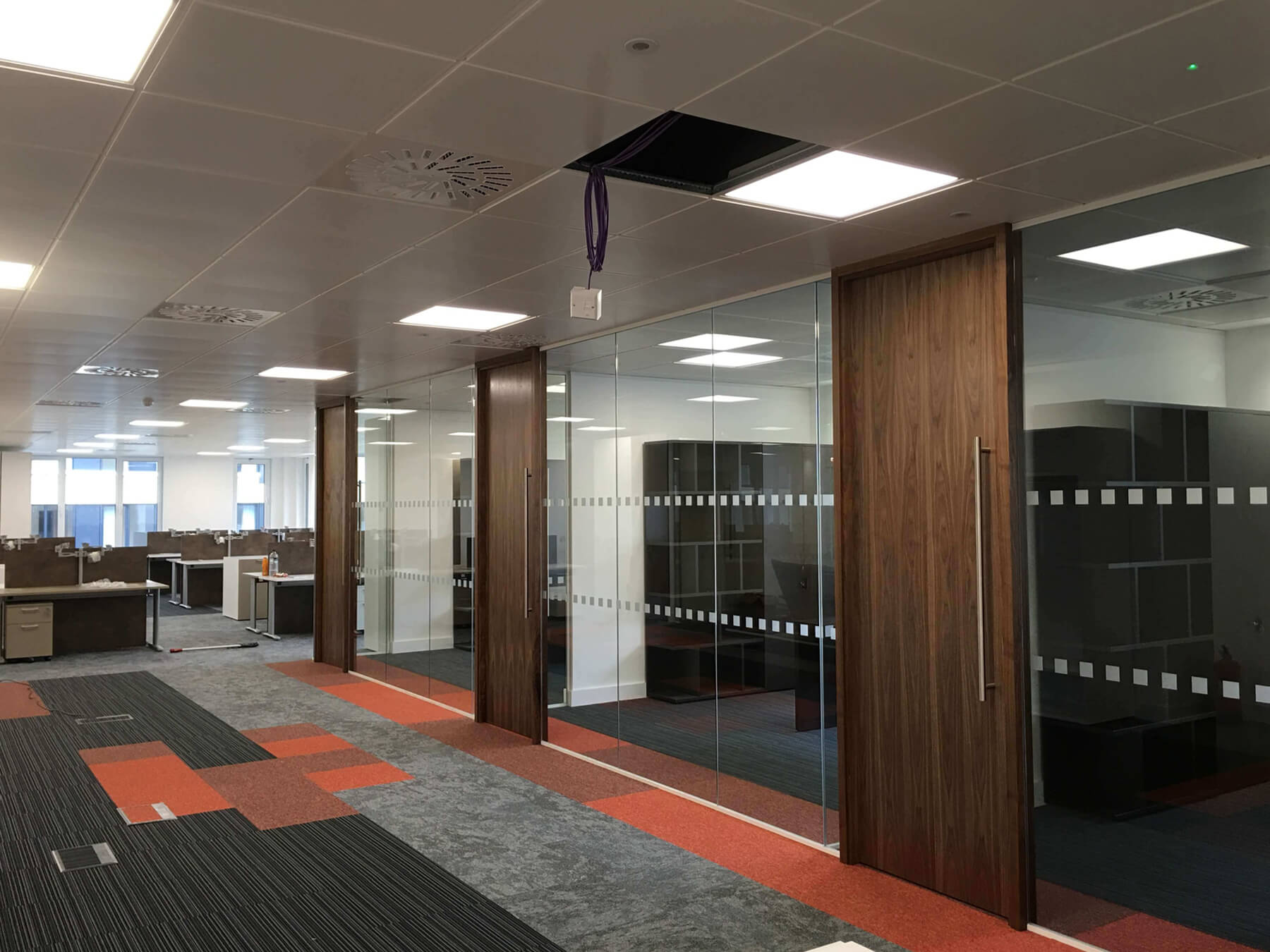 Large office space with designer floor and glass doors Large office space with designer floor and glass doors