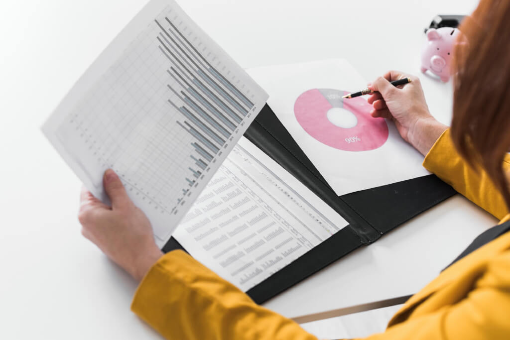 Close up business woman analysis process