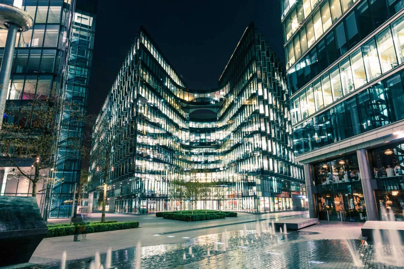 Modern architecture at night on riverbank in London Modern architecture at night on riverbank in London