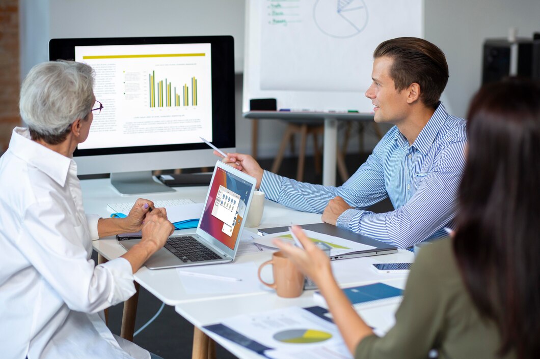 People using digital device while meeting