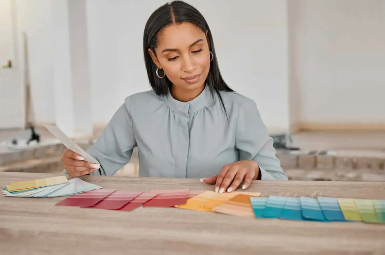 Shot of a young woman looking at different colour Shot of a young woman looking at different colour