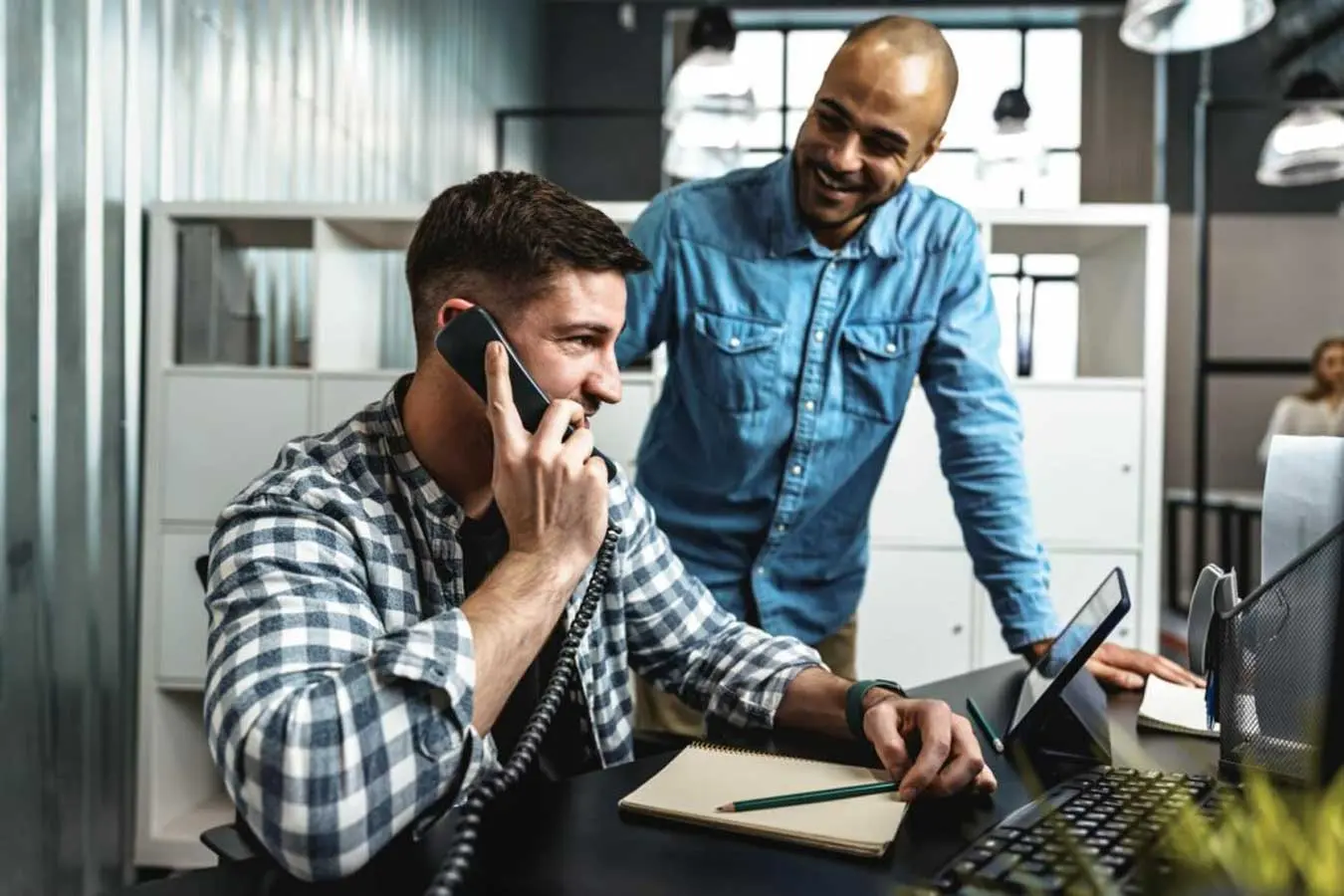 Two young men working together on a new business